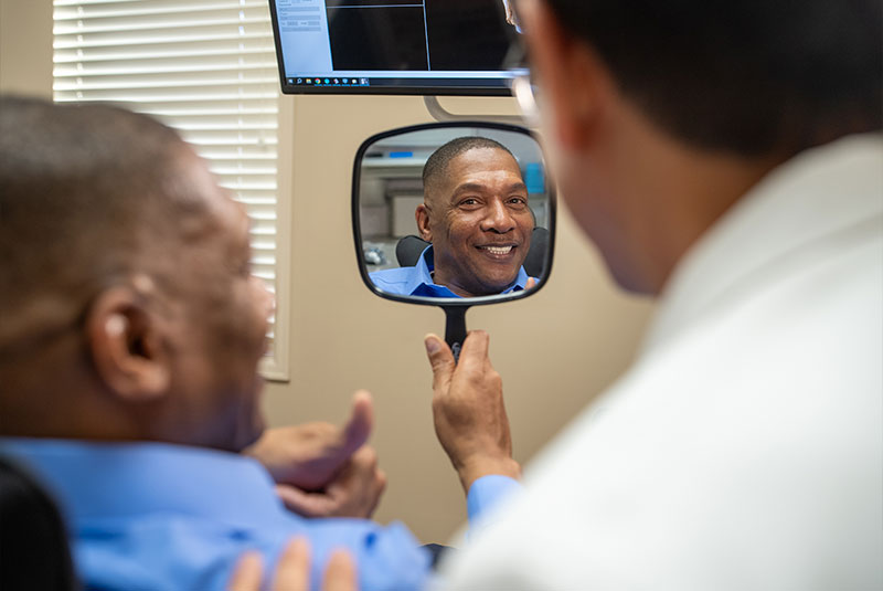 Paitent Smiling into mirror
