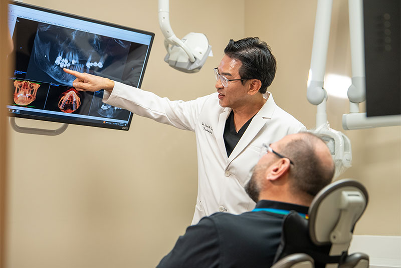 Doctor going over a x-ray with Paitent